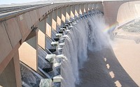 Water stored behind a dam at a hydroelectric plant has gravitational potential energy.