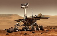Spirit (Mars Exploration Rover-A) as it prepares to examine a rock on the planet Mars.