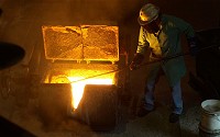 Molten metal in a foundry where metals are melted in a high-temperature furnace.